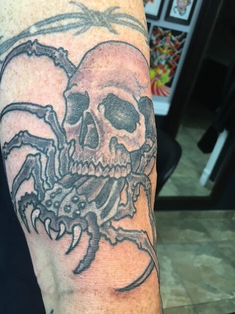 skull and spider tattoos
